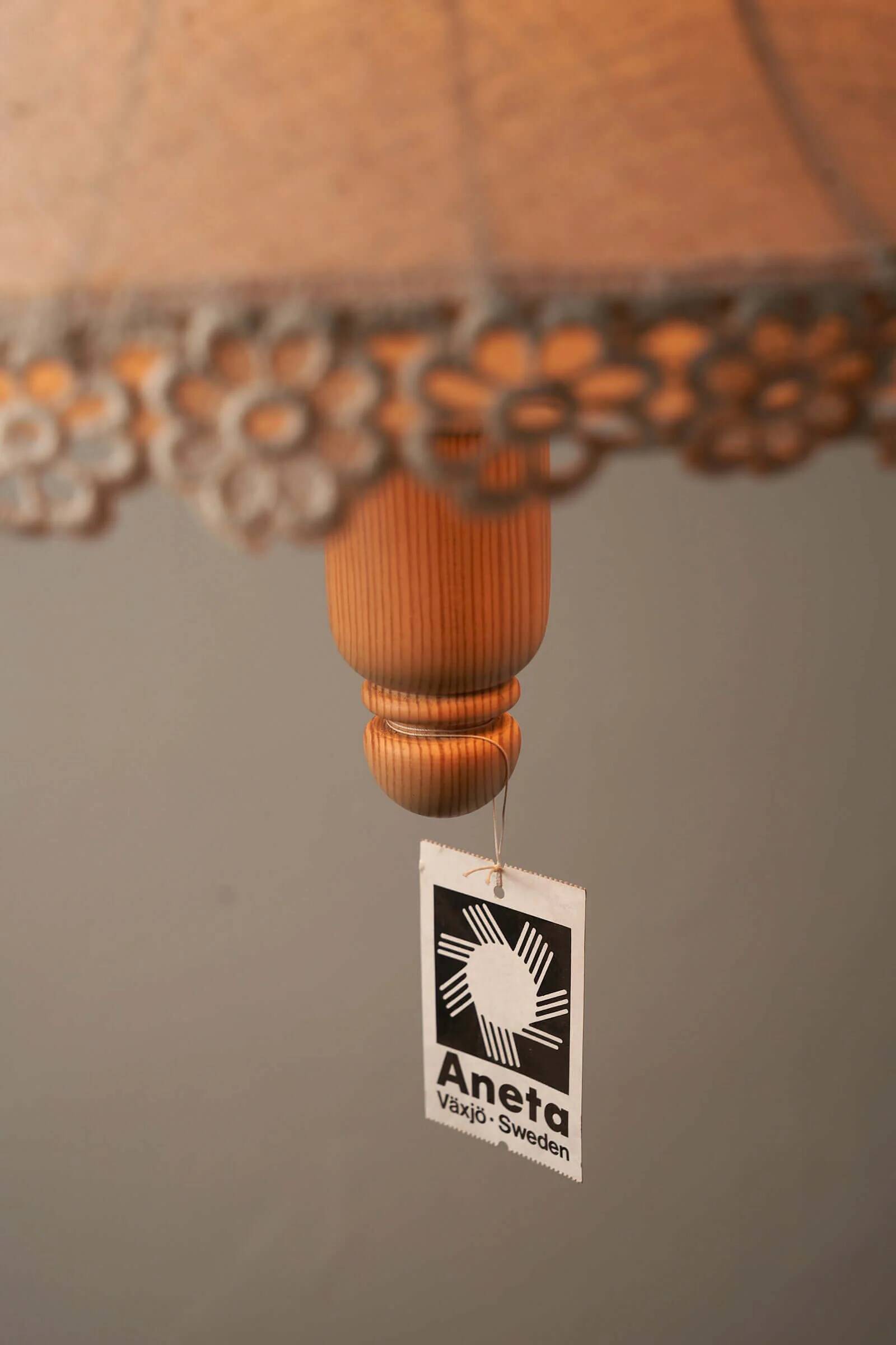 Wood and textile pendant from Sweden