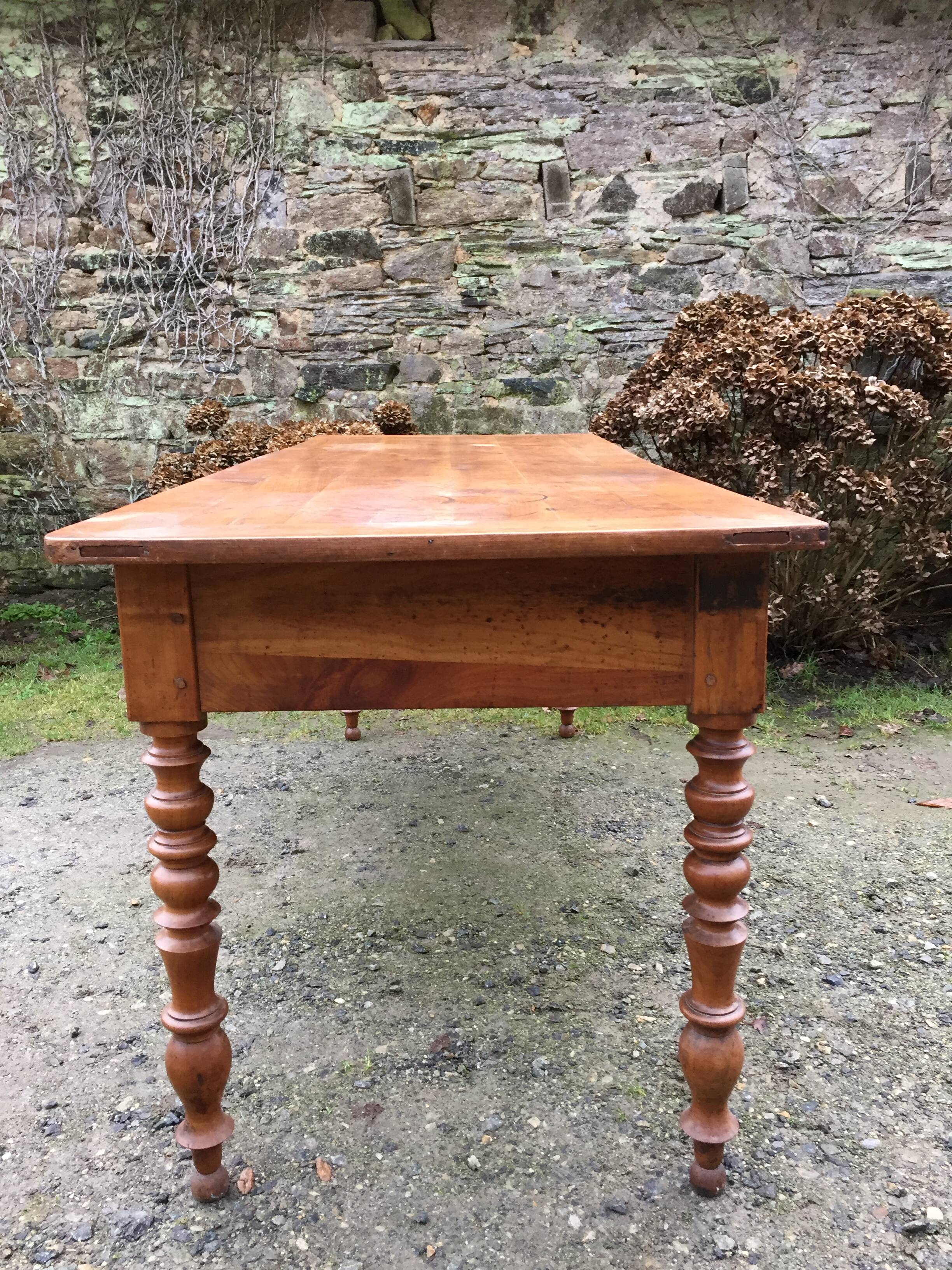 Old cherry farmhouse table with 3 drawers and turned legs