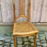 Vintage caned Louis XVI chair in solid gold wood.