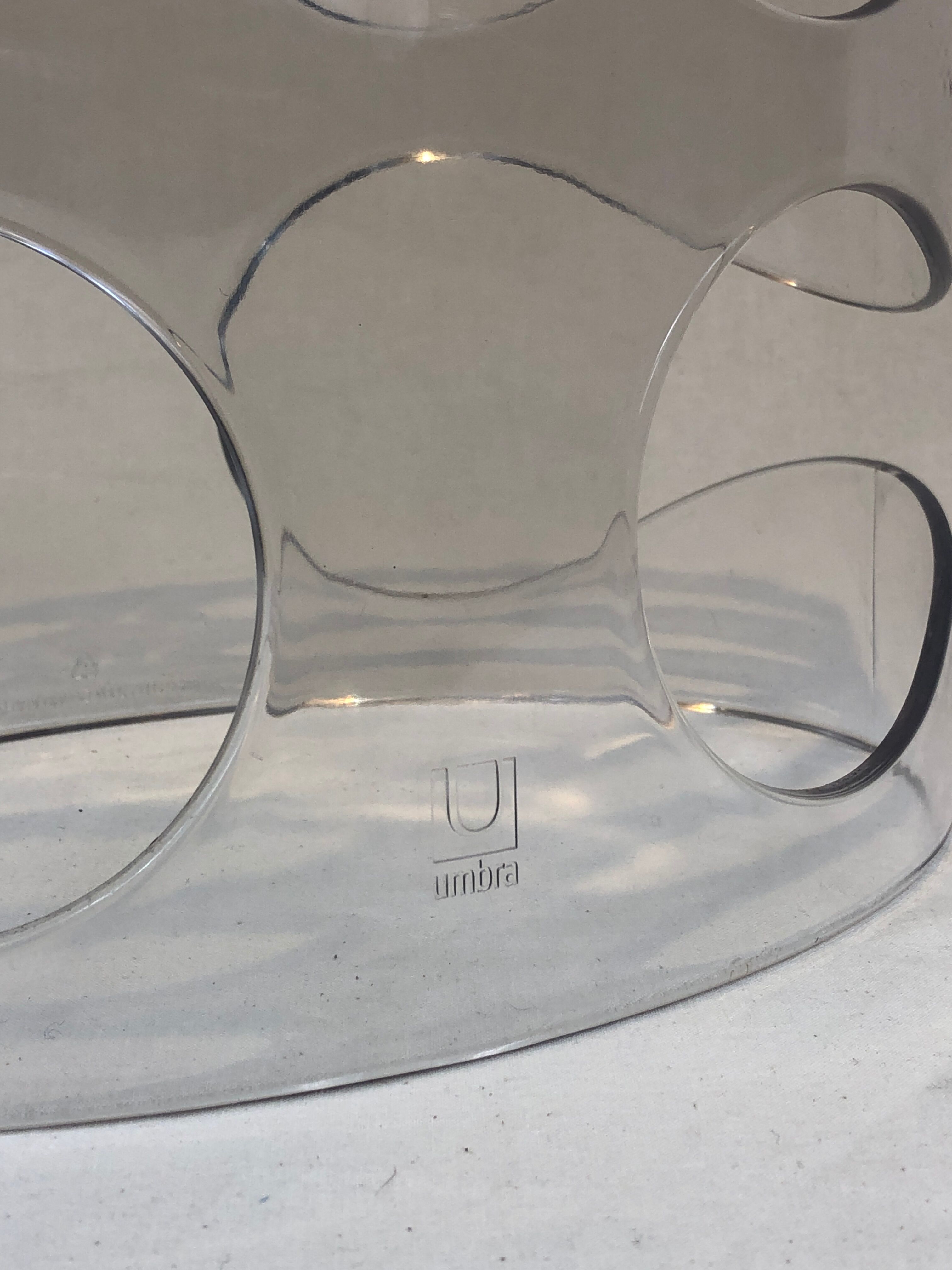 Transparent plexiglass bottle holder Umbra design Ran Lerner