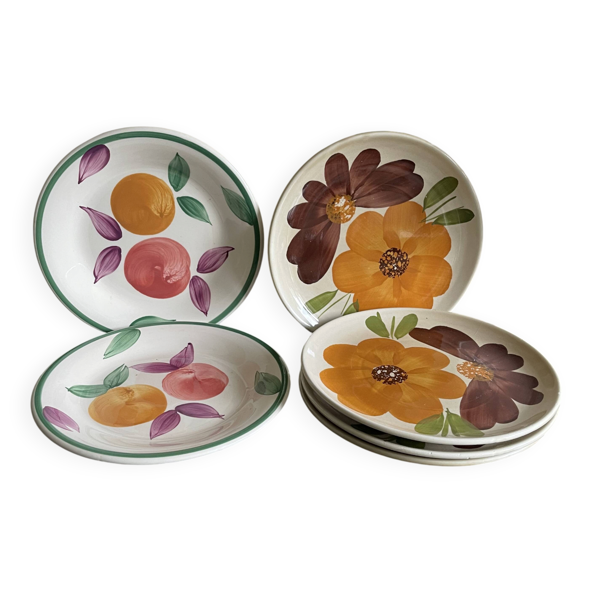 Italian ceramic plates with floral fruit designs.