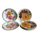 Italian ceramic plates with floral fruit designs.