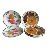 Italian ceramic plates with floral fruit designs.