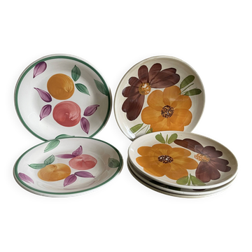Italian ceramic plates with floral fruit designs.