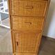 Storage column, wooden bookshelf and woven rattan.