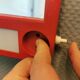 Red danish make up mirror with light and power plug from the 1970