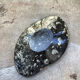 Empty tray pocket in fossilized stone