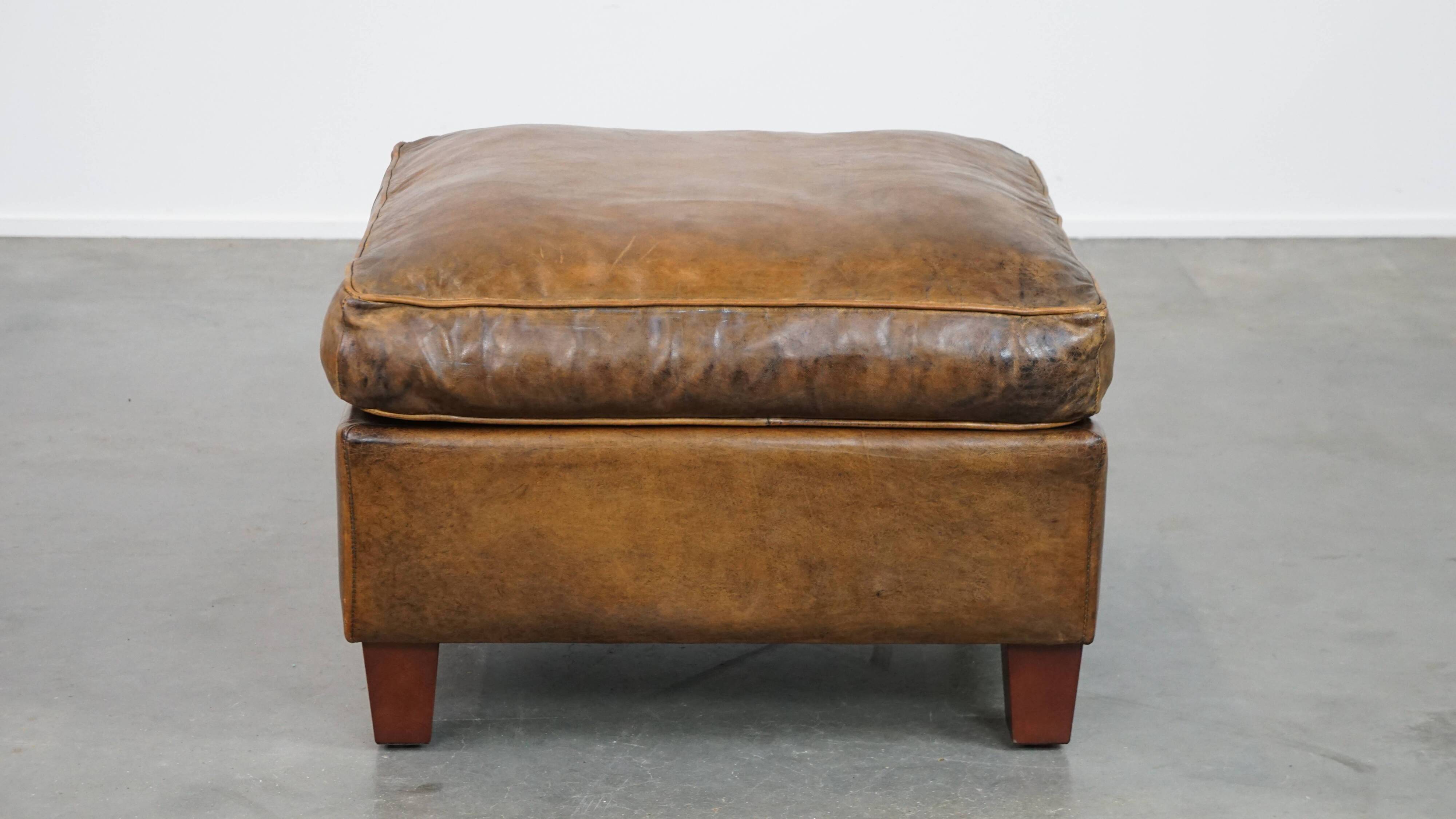 Sheepskin wing chair + XXL patinated footrest