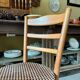 Baumann bistro chair in beech and orange and black geometric cotton