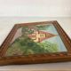 Small painting of a flowered house in oil on cardboard.