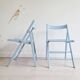 Blue folding chairs in lacquered wood