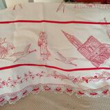 Large white tablecloth and red handmade embroidery. Lace surround;