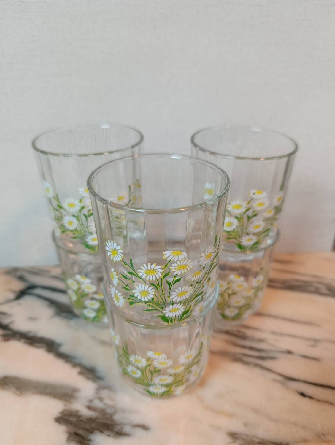 Orangeade service with a jug and six glasses featuring a daisy pattern.