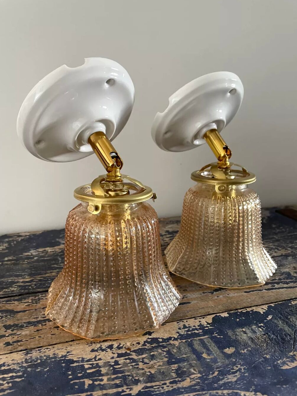 Pair of vintage sconces in electrified gold chiseled glass