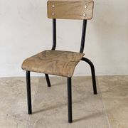 Vintage children's school chair in wood and black metal, industrial style.