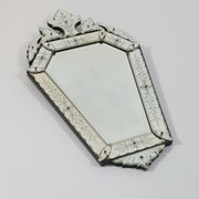 Venetian wall mirror in Murano glass with faceted floral decoration from the 1930s.