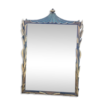 Carved wooden mirror with rushes and a pagoda.