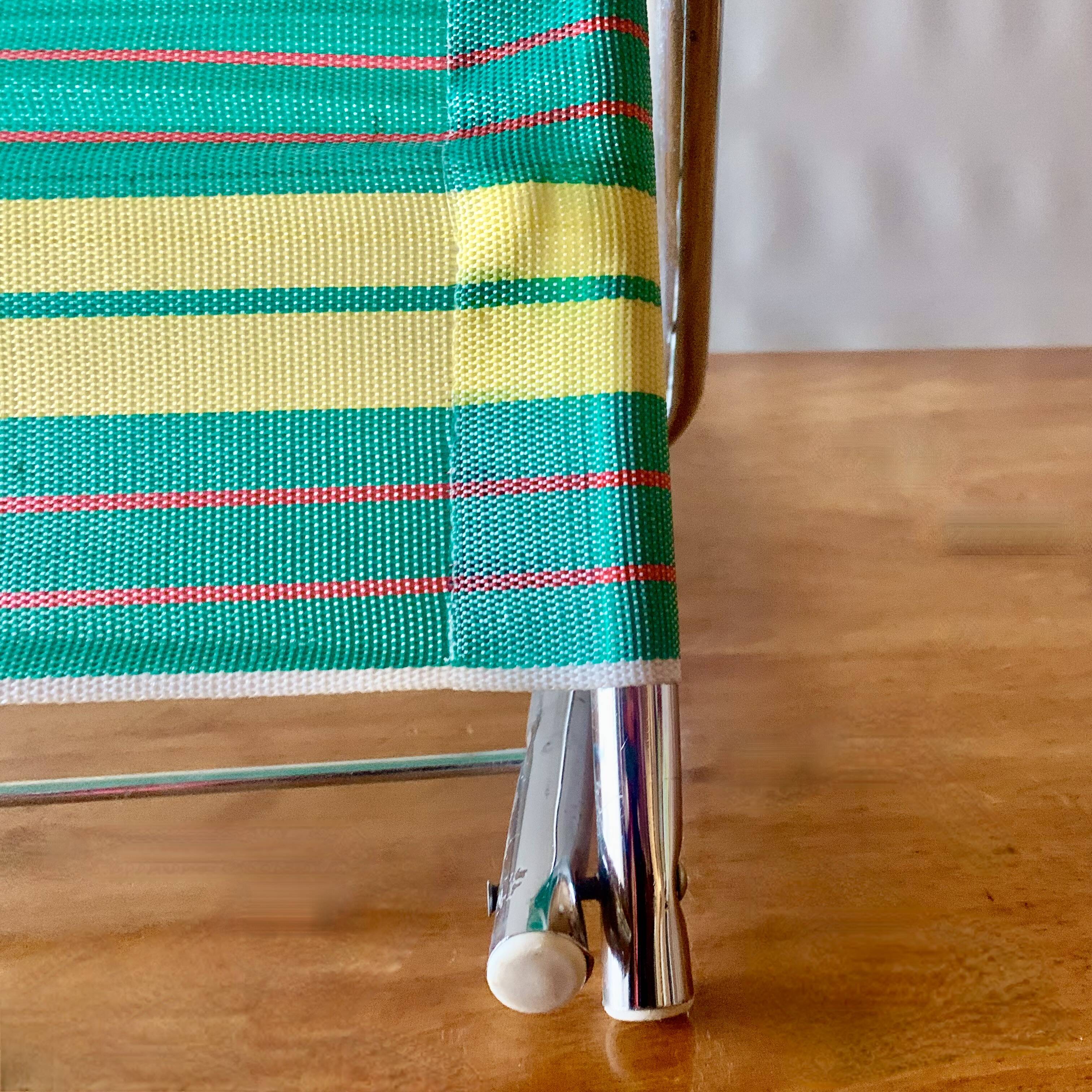 Vintage folding beach chair in chrome metal and woven plastic