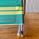 Vintage folding beach chair in chrome metal and woven plastic