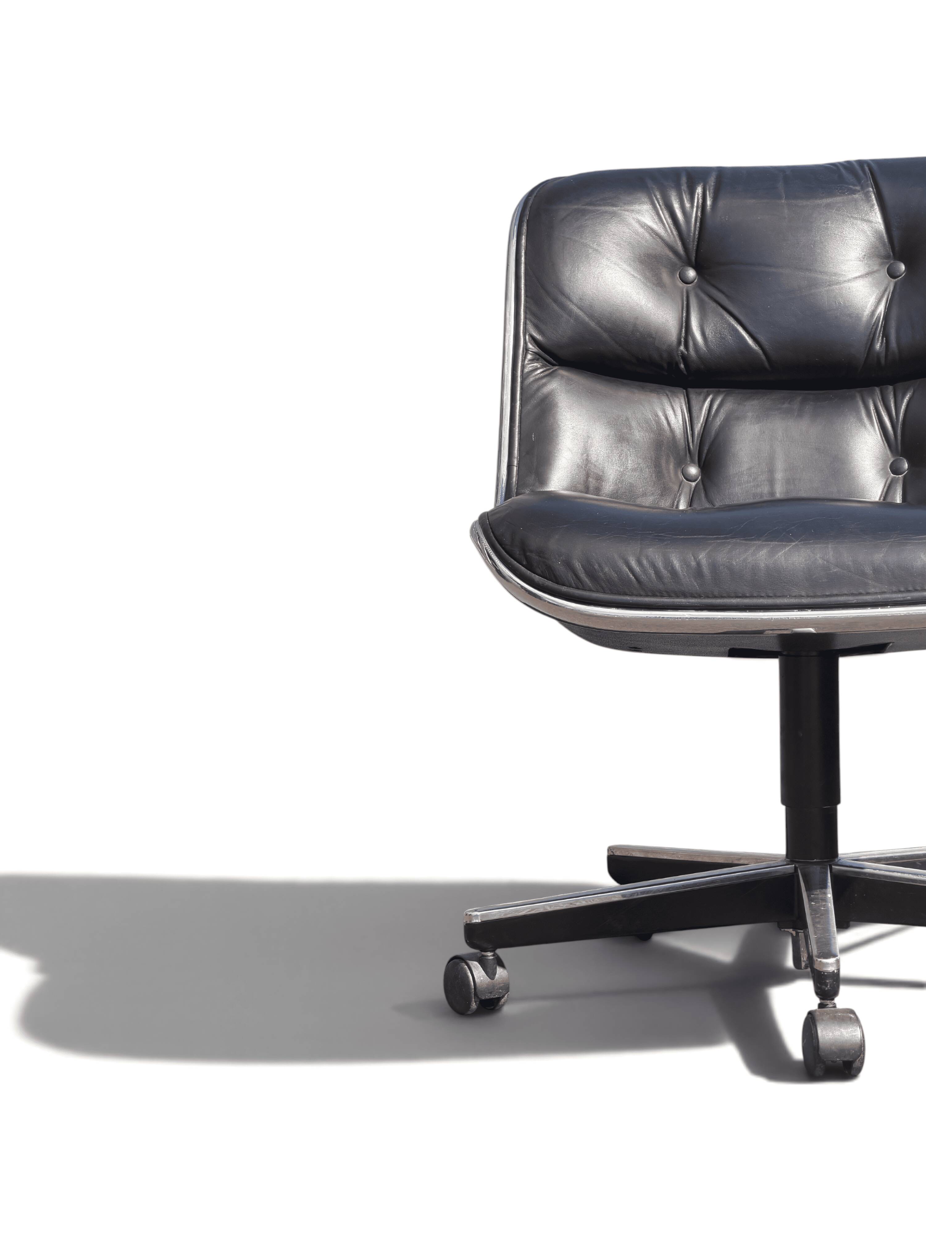 Charles Pollock Knoll office chair in black leather without armrests.