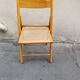 Wooden folding chair with caning from the 1980s.