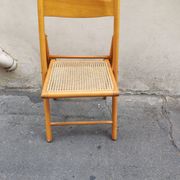 Wooden folding chair with cane from the 1980s.