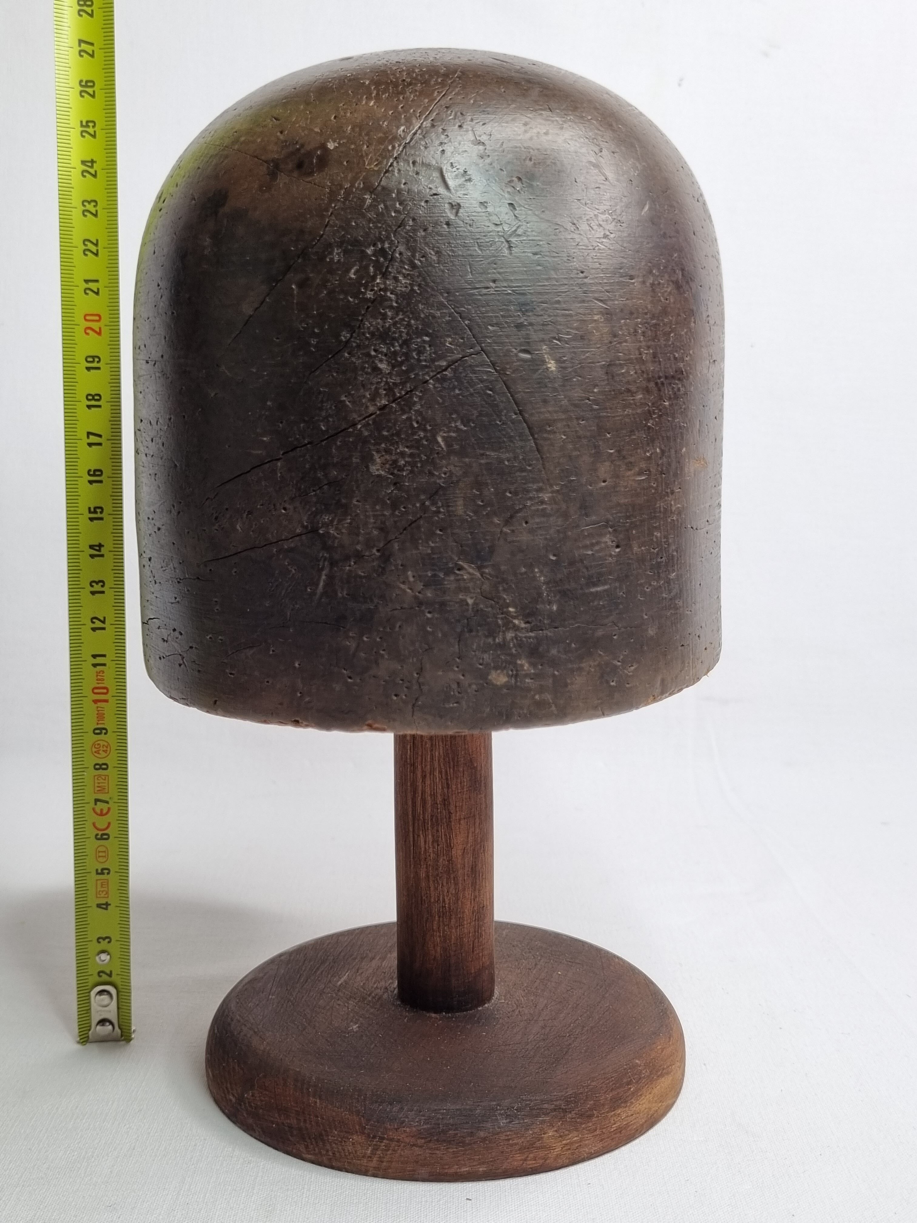 Old solid wood hat shape on foot, 1900