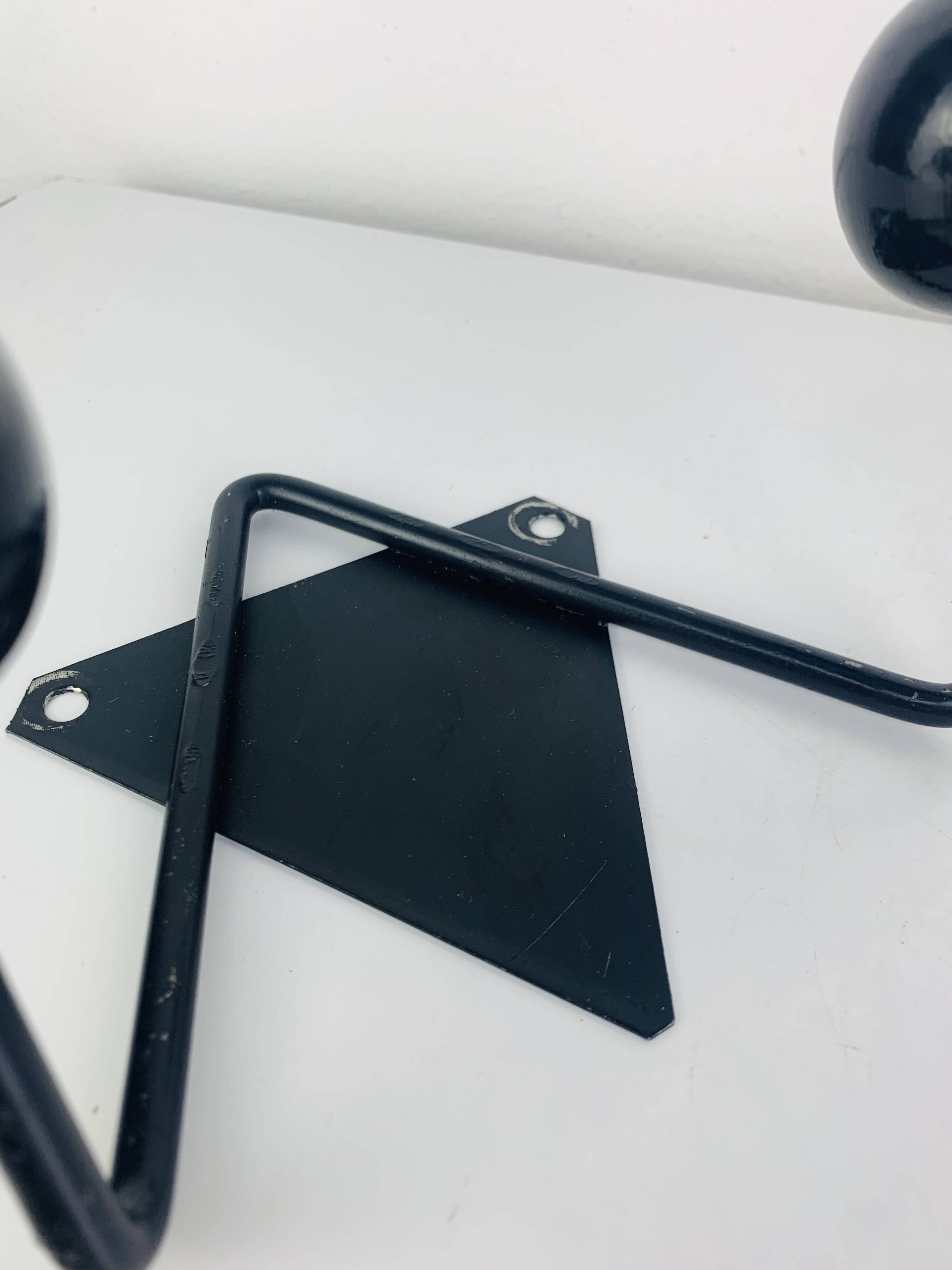 Pair of wall hooks from the 1950s, black metal