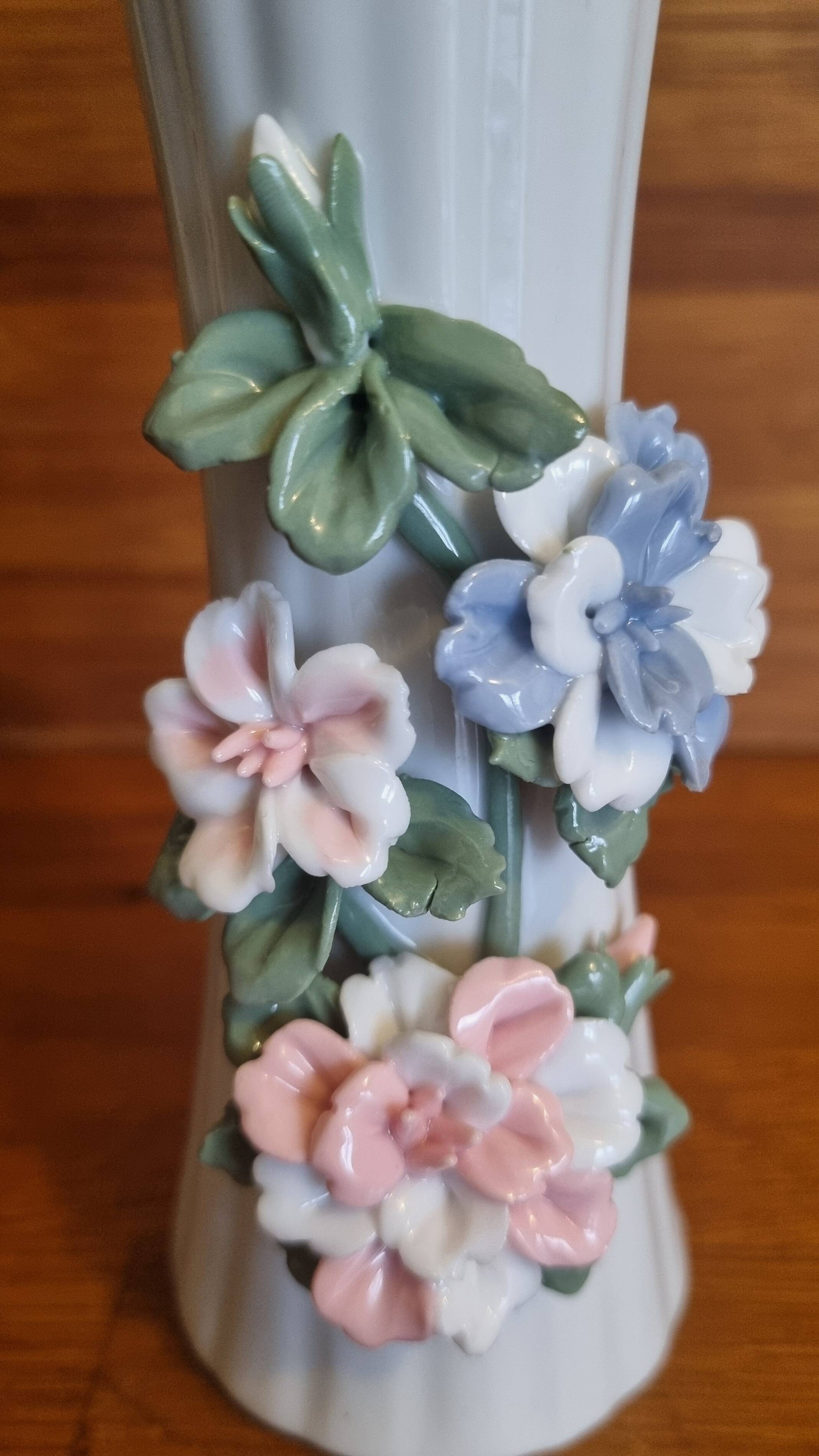 Porcelain vase with flowers in relief