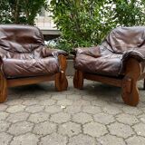 2 Brutalist armchairs in wood and leather 1970