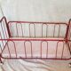 Vintage doll bed large model in red lacquered metal and matching mattress
