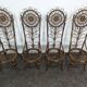 Set of 4 bamboo and rattan chairs with sunflower decoration.