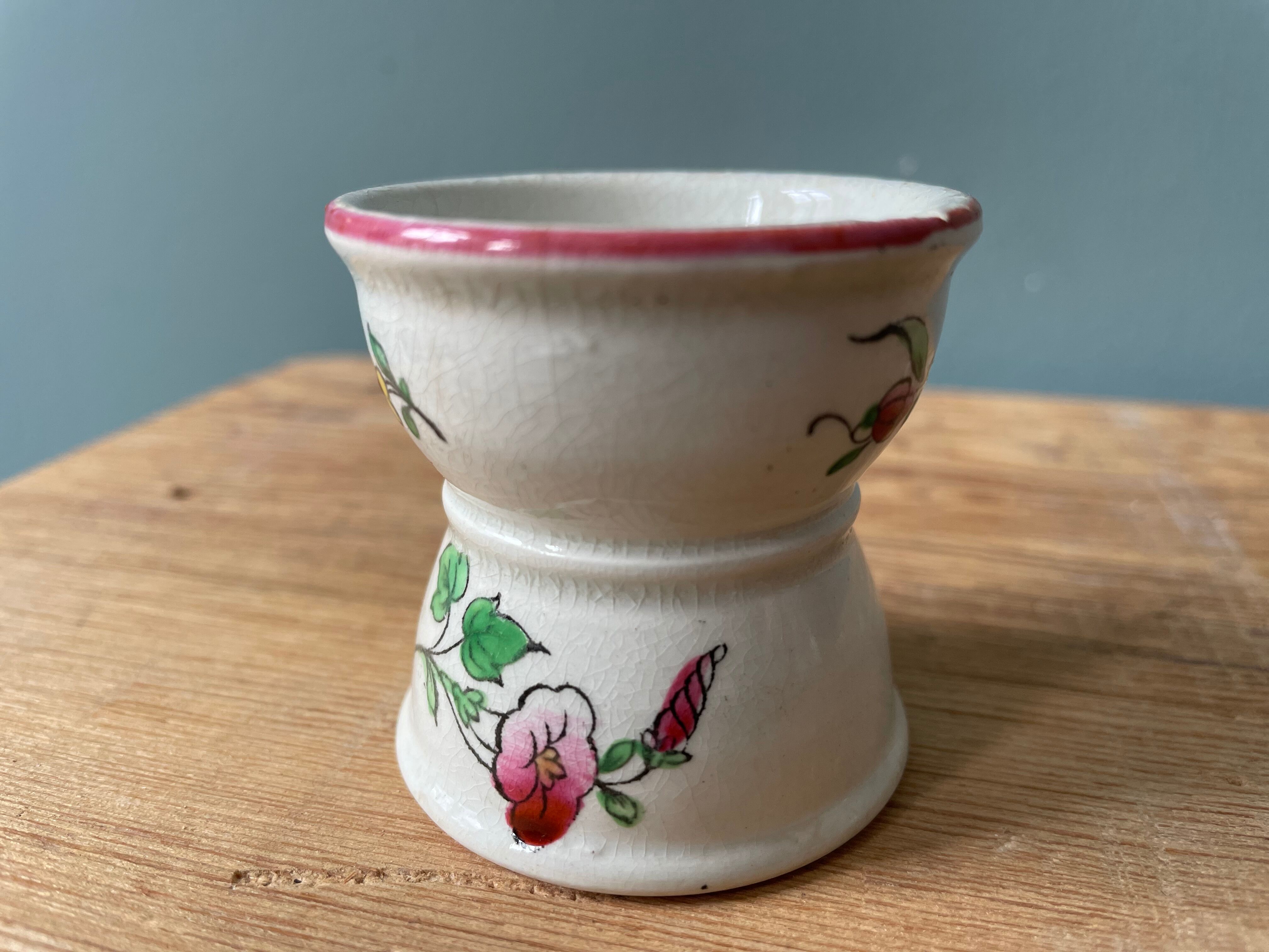 Pair of diabolo eggcups in ancient earthenware