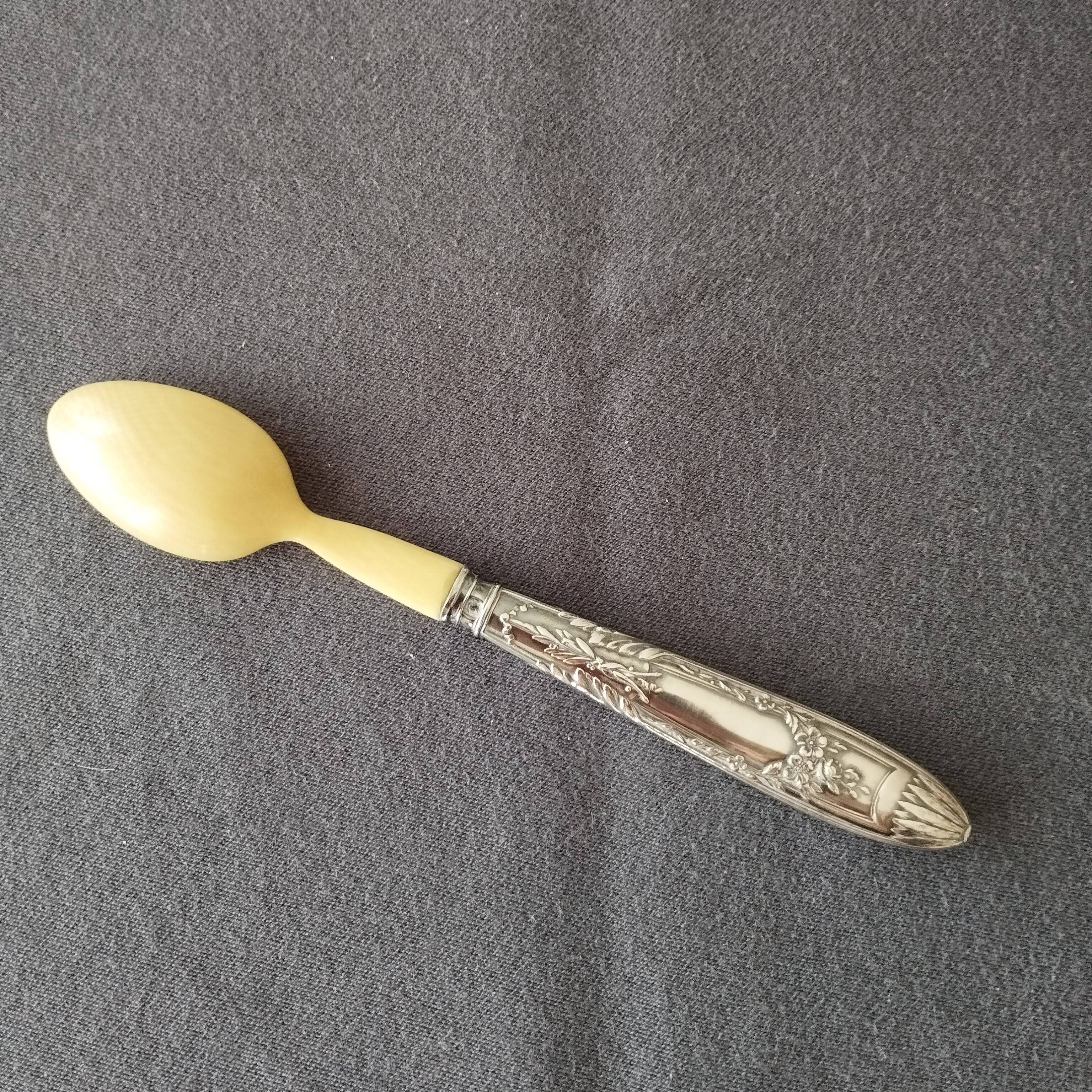 silver-plated baby feeding spoon