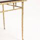 Maison Baguès. Table basse en bronze, laque noire, décor or. Circa 1970