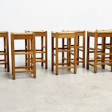 set of seven rattan and wood barstools