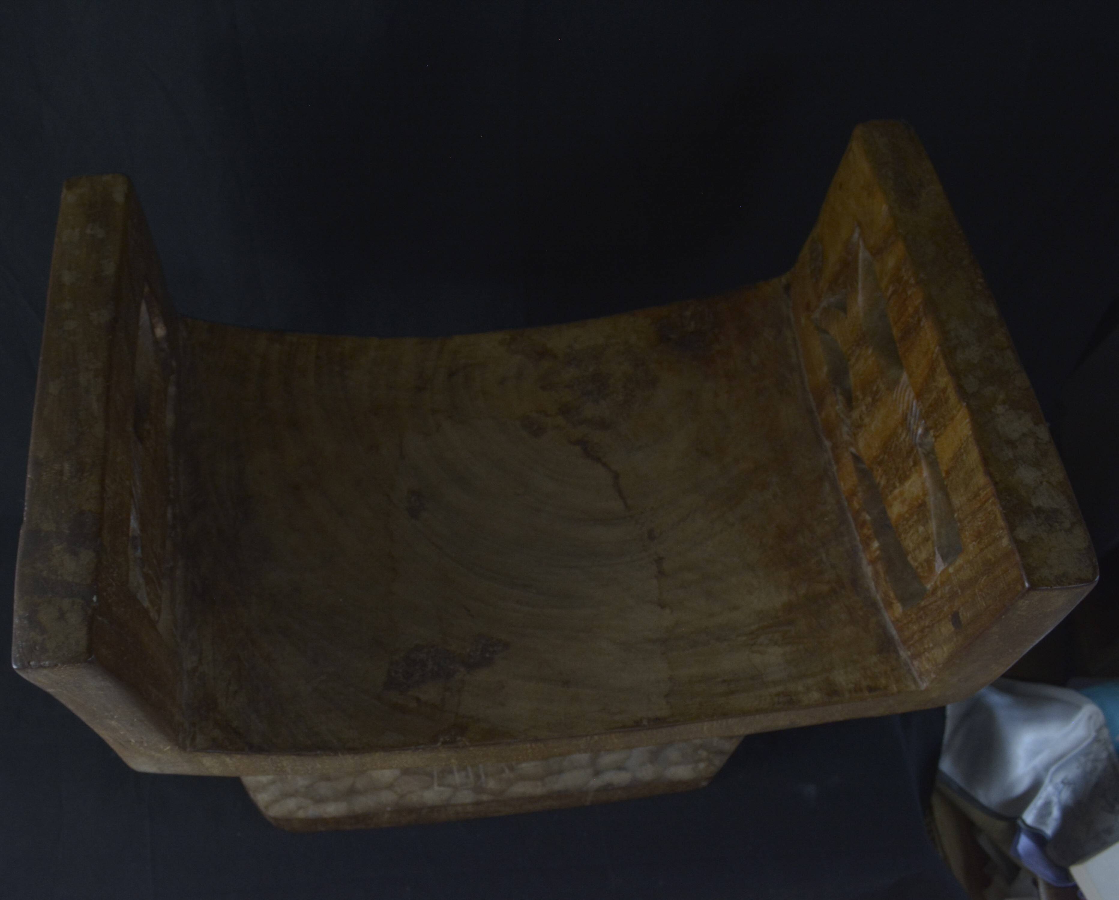 Togolese ethnic stool in carved exotic wood.