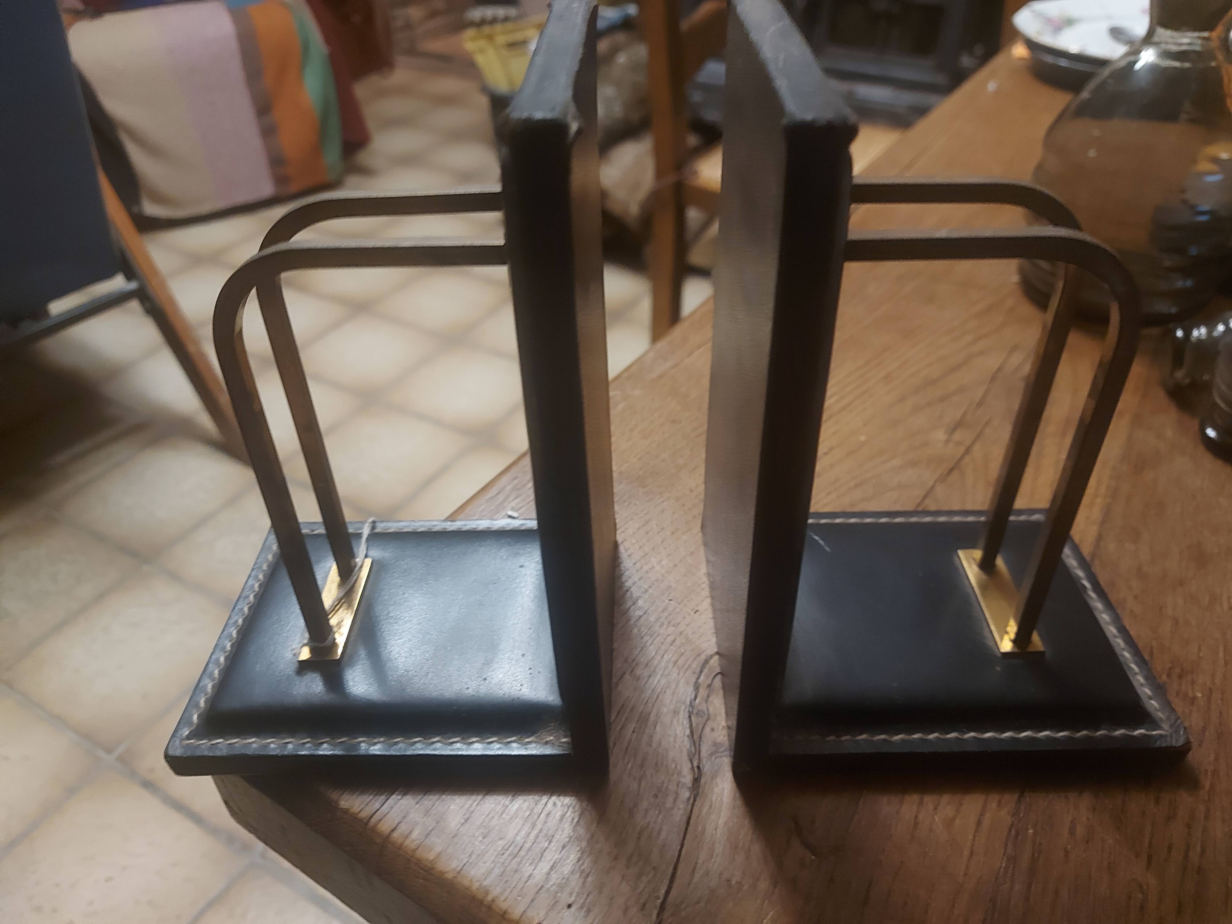 2 modernist leather bookends attributed to Jacques Adnet