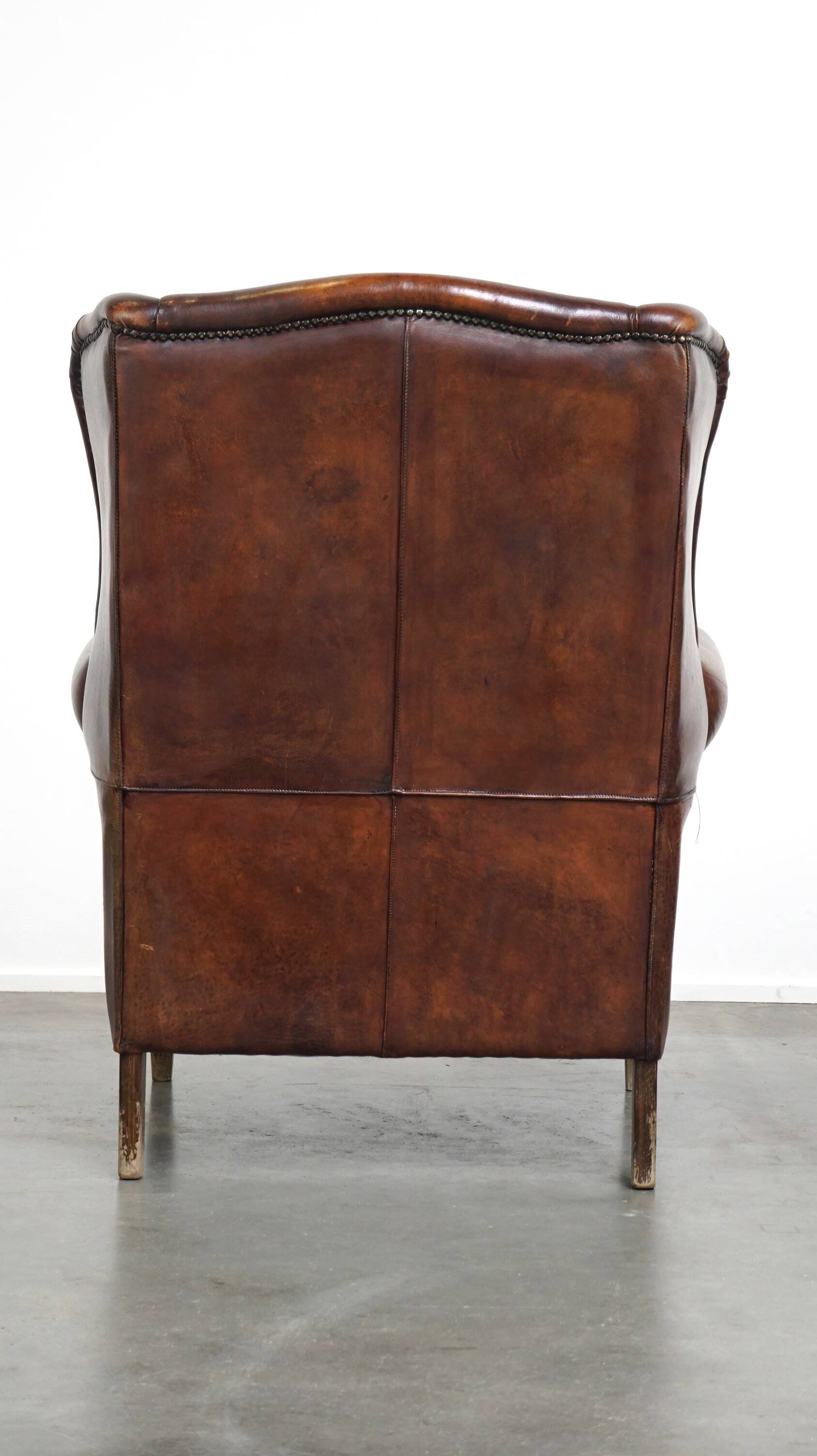 Large sheepskin wing chair with excellent colour and great seating comfort