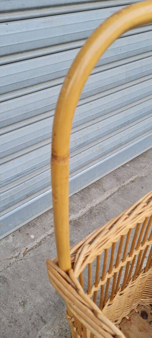 Vintage wicker log basket on vintage wheels