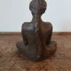 Terracotta statue of a woman with child, signed