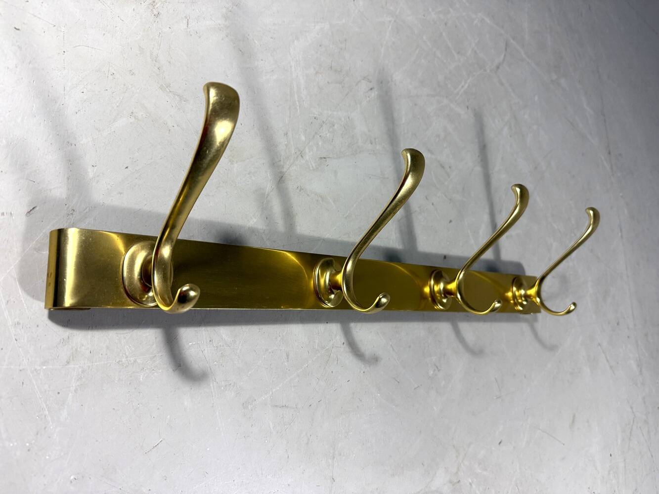 Gold coloured aluminium wall coat rack 1960’s