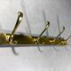 Gold coloured aluminium wall coat rack 1960’s