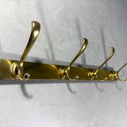 Gold coloured aluminium wall coat rack 1960’s