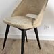 Pair of vintage barrel chairs in boucle fabric with brass splayed legs.