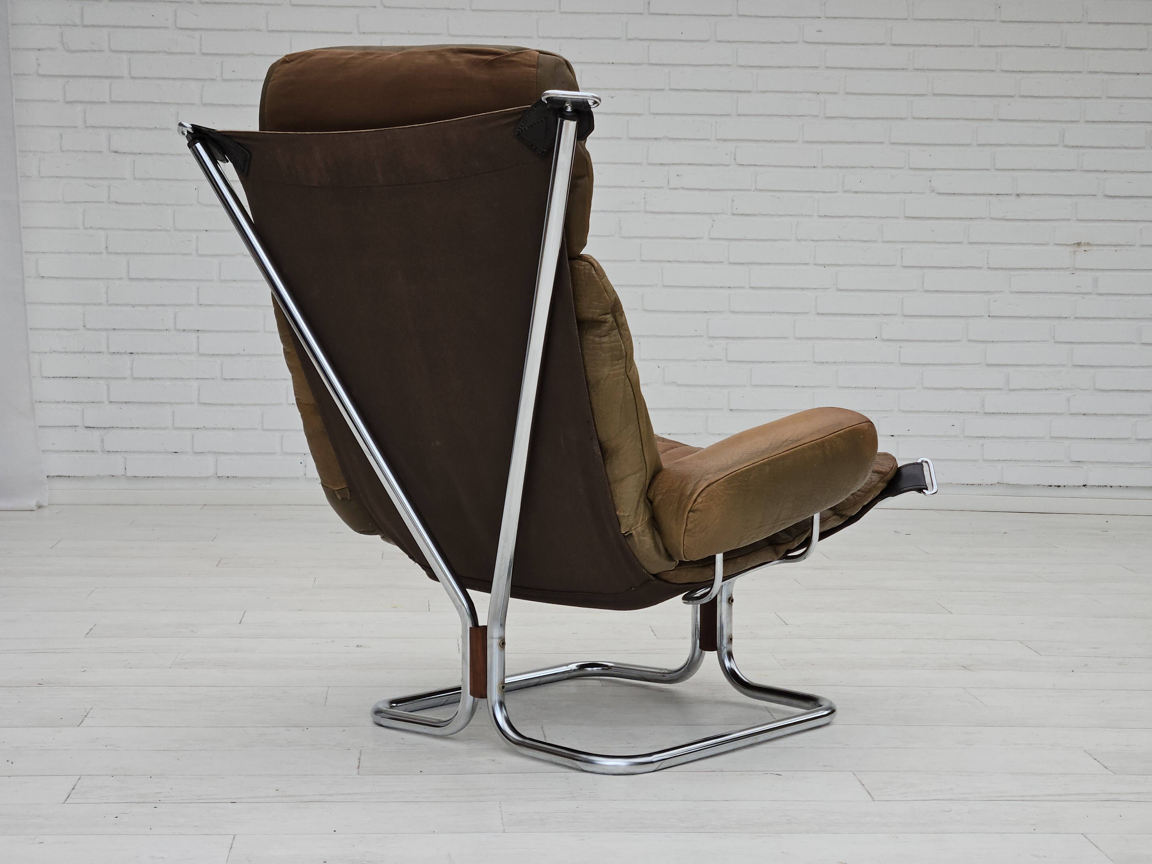 1970s, Norwegian design by Harald Relling, original condition, leather, chrome steel, teak wood.