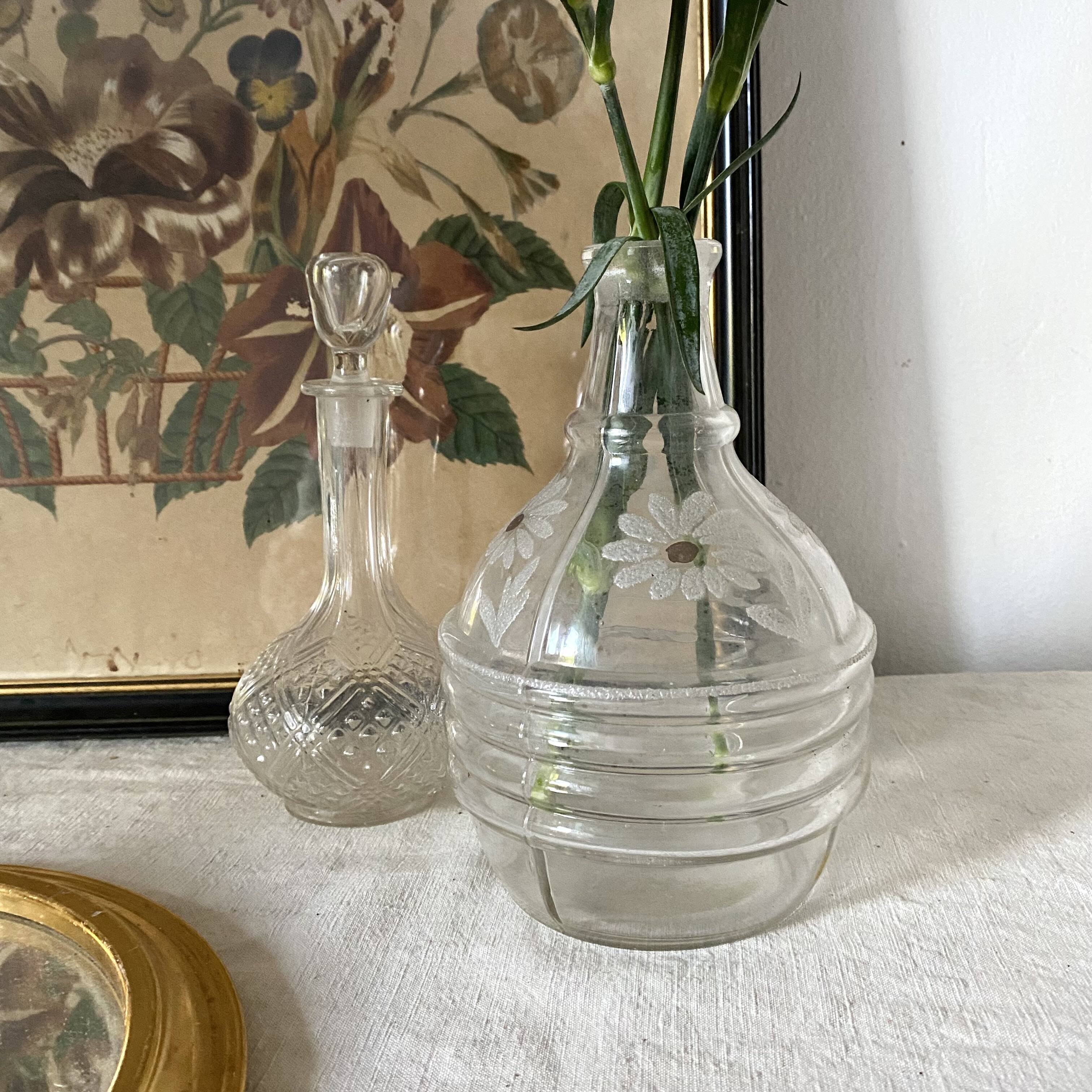 Antique carafe, daisy-decorated vase