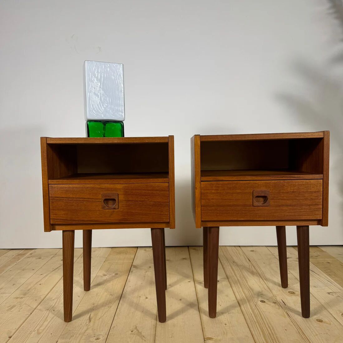 Pair of mid-century modern teak bedside tables with drawer.