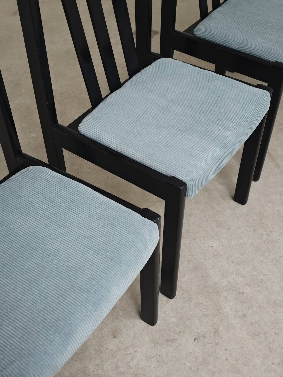 Set of 4 modernist black chairs with light blue ribbed fabric