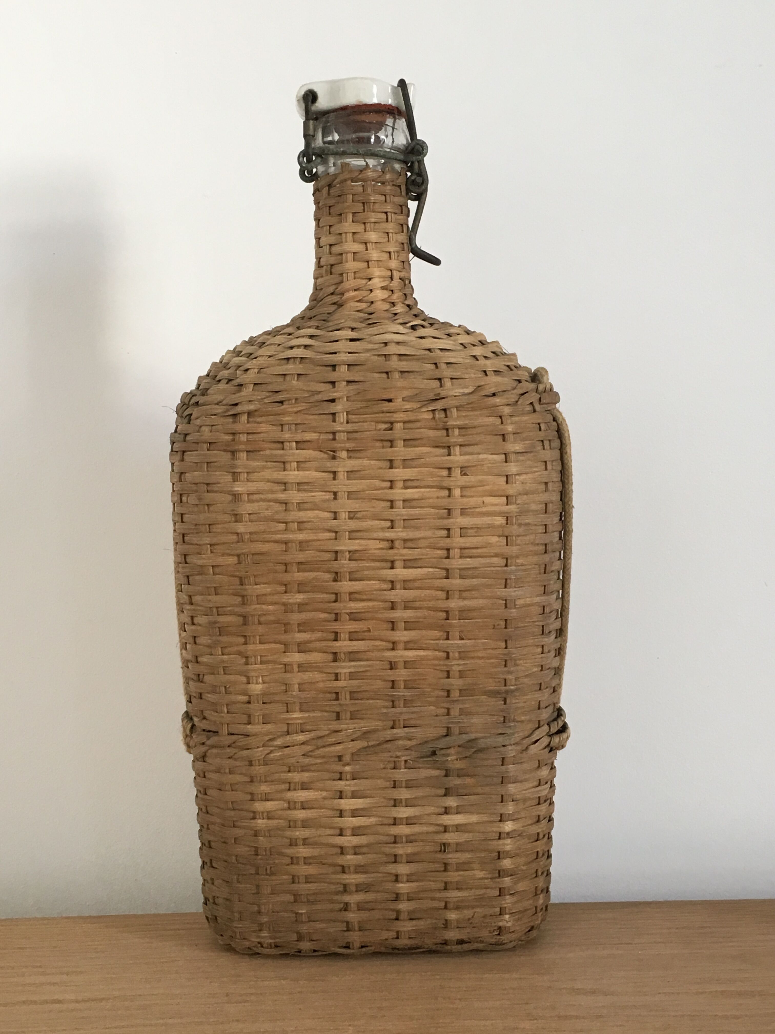 Glass bottle and wicker